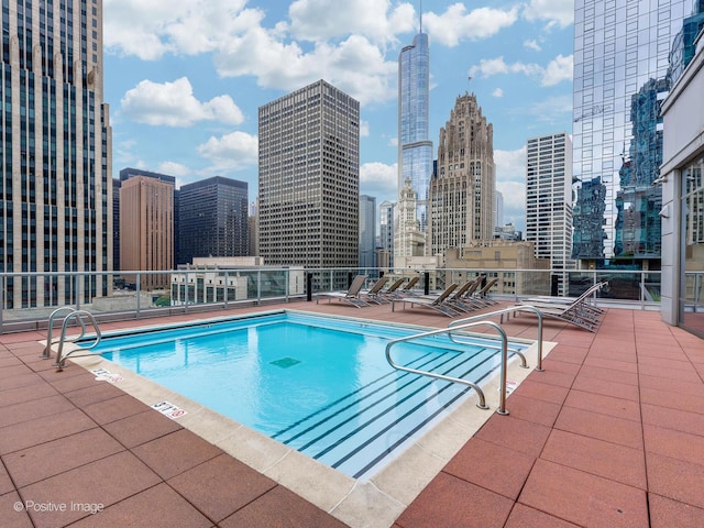 view of swimming pool featuring a patio