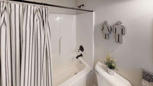 bathroom with toilet and shower / tub combo with curtain