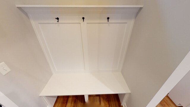 mudroom with wood-type flooring