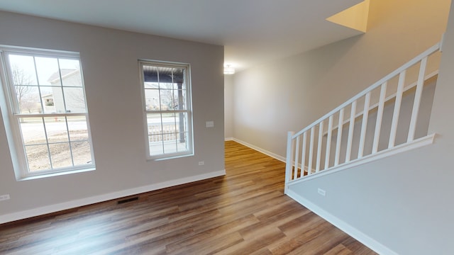 spare room featuring hardwood / wood-style floors