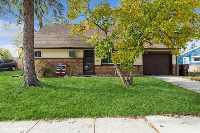 view of front of home with a front lawn and a garage