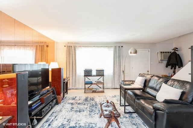 carpeted living room with a wall mounted AC and a wealth of natural light