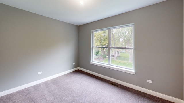 unfurnished room featuring carpet flooring