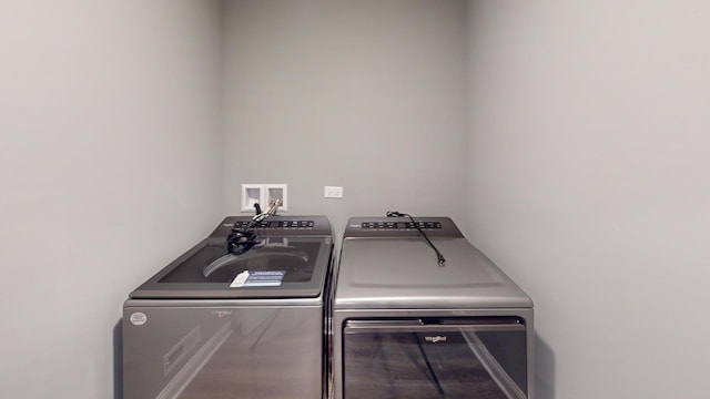 laundry area featuring washing machine and clothes dryer