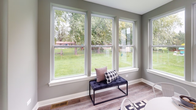 sunroom / solarium featuring plenty of natural light