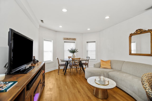 living room with light hardwood / wood-style floors