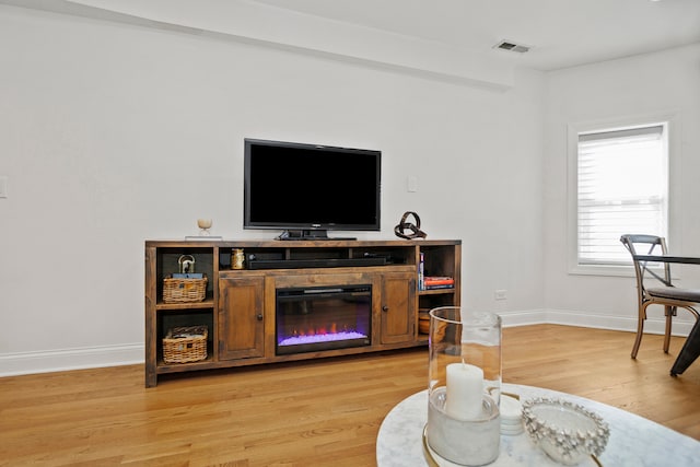 living room with light hardwood / wood-style flooring