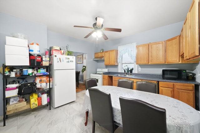 kitchen featuring white appliances, ceiling fan, and sink