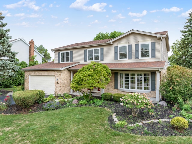 front of property with a front lawn and a garage