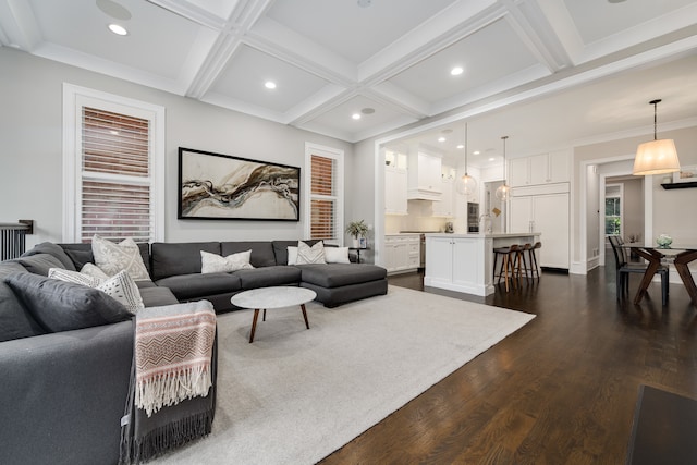 living room featuring beam ceiling, coffered ceiling, ornamental molding, and dark hardwood / wood-style flooring