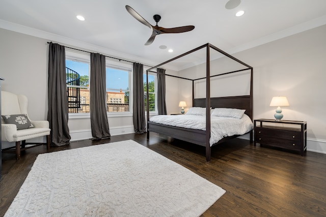 bedroom with ceiling fan, crown molding, and dark hardwood / wood-style flooring