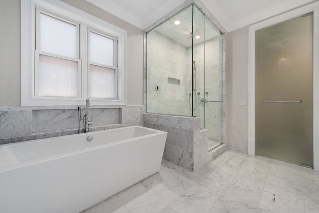 bathroom with separate shower and tub