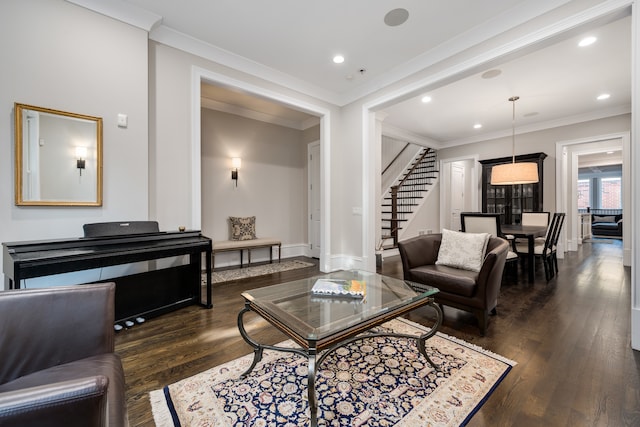 living room with crown molding and dark hardwood / wood-style flooring