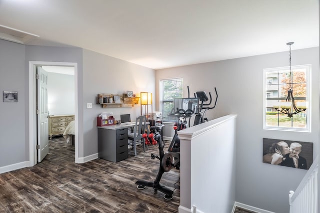 office featuring a notable chandelier and dark hardwood / wood-style floors