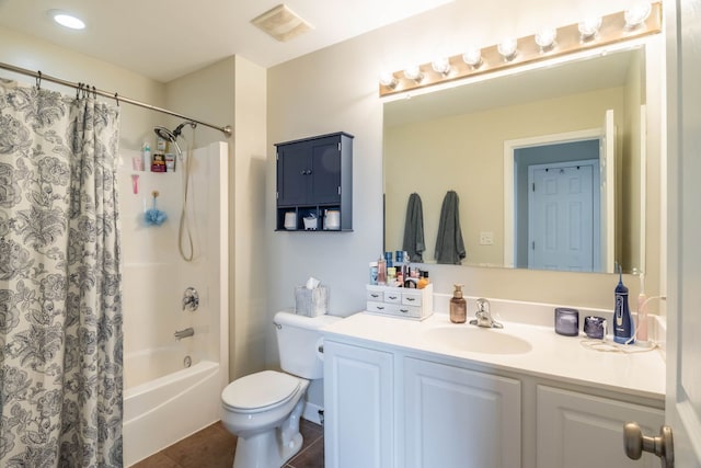 full bathroom with vanity, shower / tub combo with curtain, toilet, and tile patterned flooring