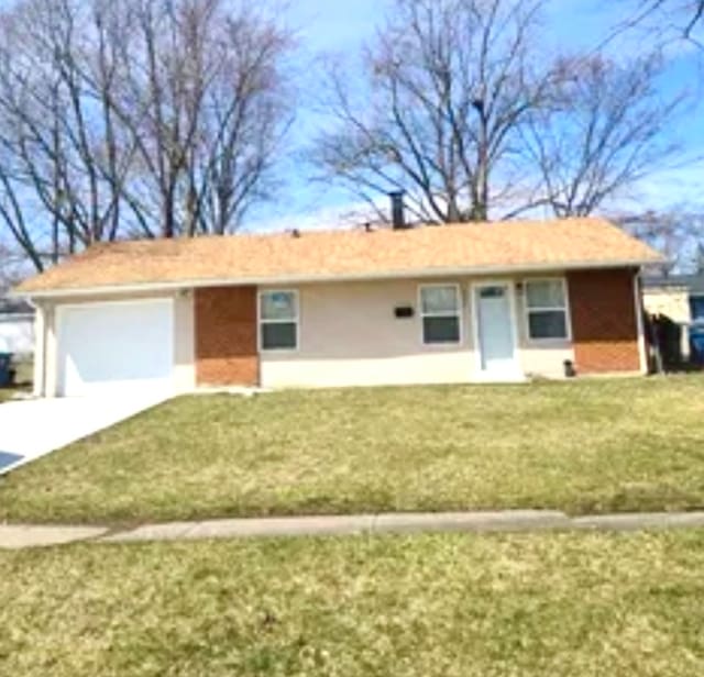 ranch-style house with a front lawn and a garage