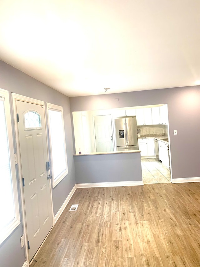 entrance foyer with light hardwood / wood-style floors