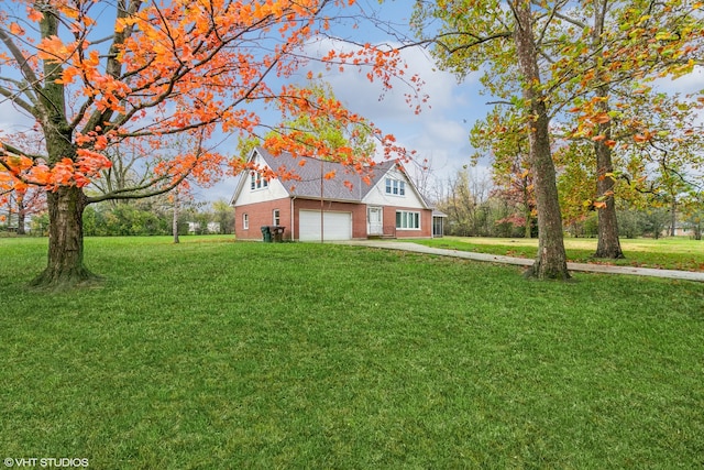 view of front of house featuring a front lawn and a garage