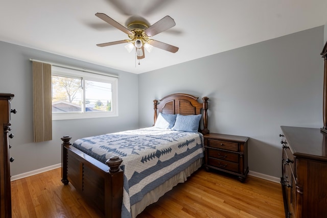 bedroom with light hardwood / wood-style floors and ceiling fan