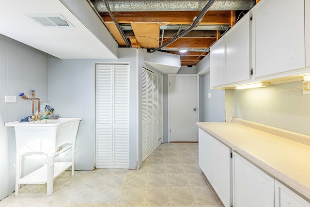 washroom with wooden walls and light tile patterned flooring