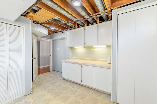 basement with light tile patterned flooring