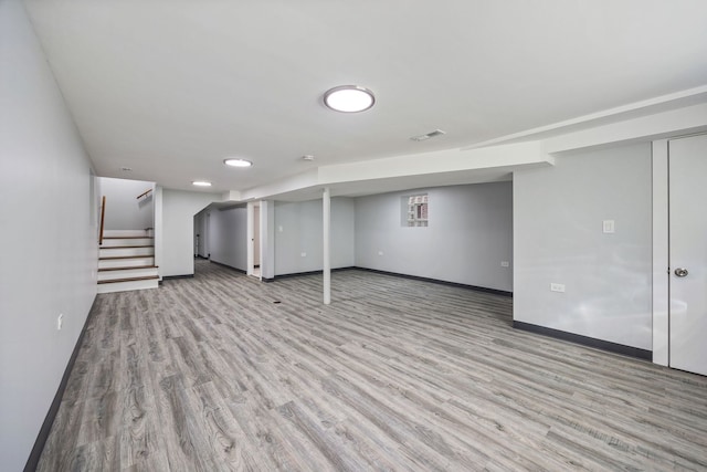 basement featuring light wood-type flooring