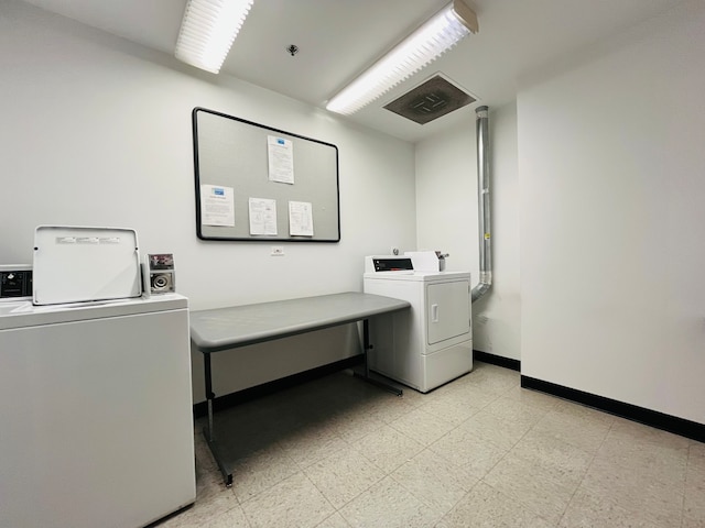 laundry area featuring washing machine and dryer