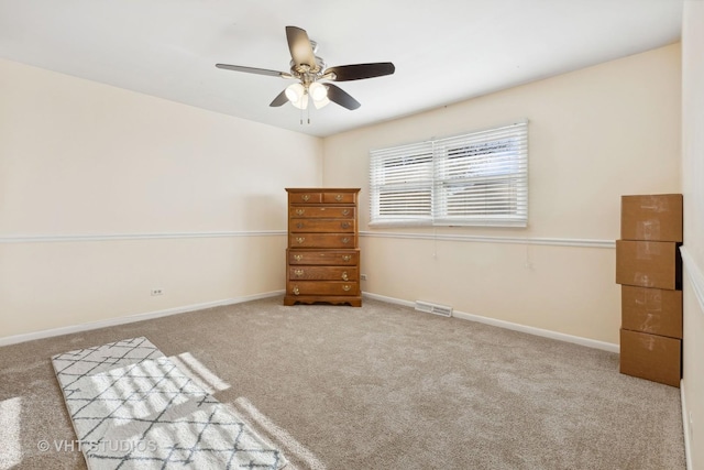 unfurnished bedroom with ceiling fan and carpet floors