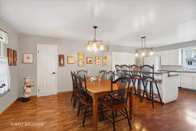 dining space with dark wood-type flooring