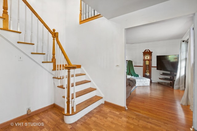 staircase featuring hardwood / wood-style flooring