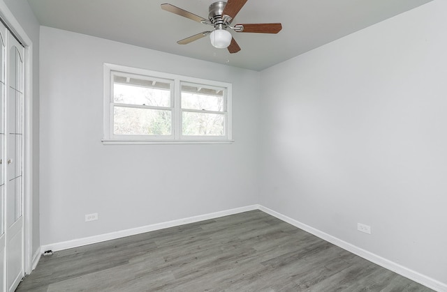 unfurnished room featuring hardwood / wood-style flooring and ceiling fan