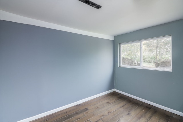 empty room with wood-type flooring