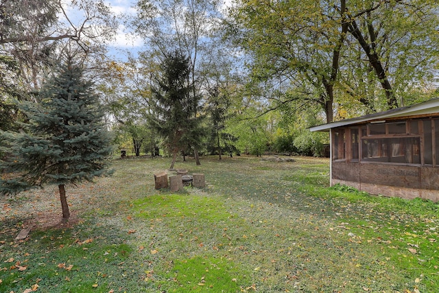 view of yard with a sunroom