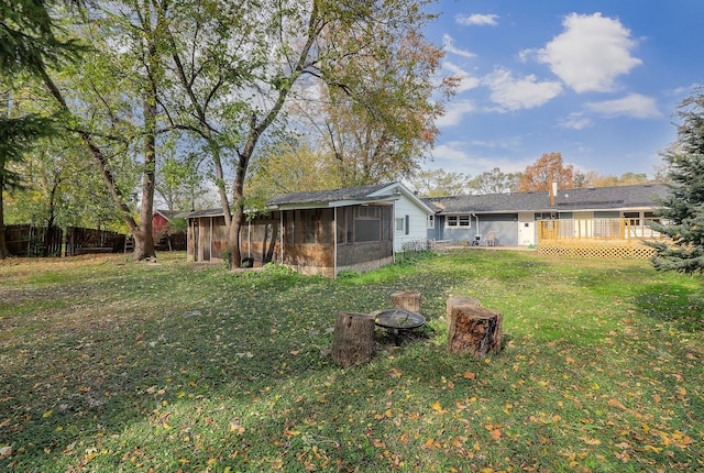 view of yard featuring a sunroom