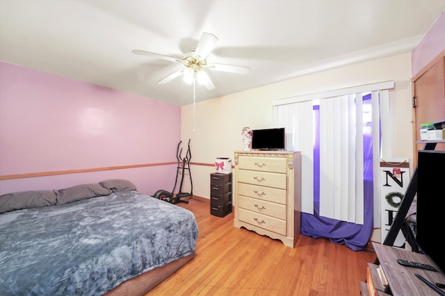 bedroom featuring light wood-type flooring and ceiling fan