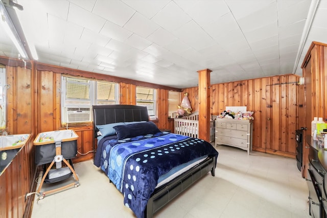 bedroom with wooden walls and cooling unit