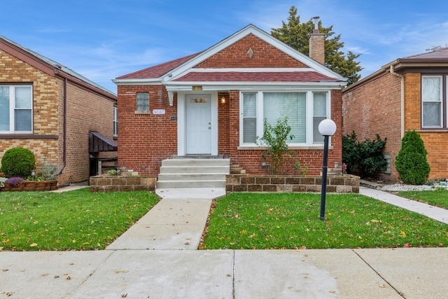 bungalow with a front yard