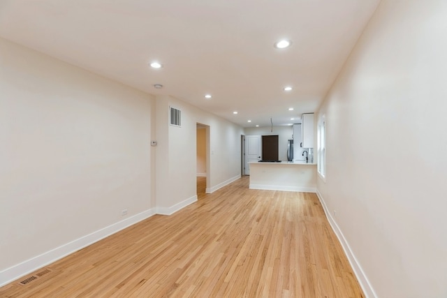 unfurnished living room with light hardwood / wood-style floors