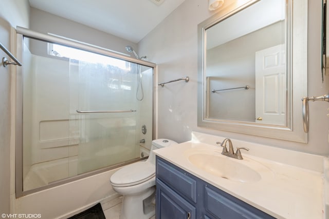 full bathroom with toilet, combined bath / shower with glass door, vanity, and tile patterned floors