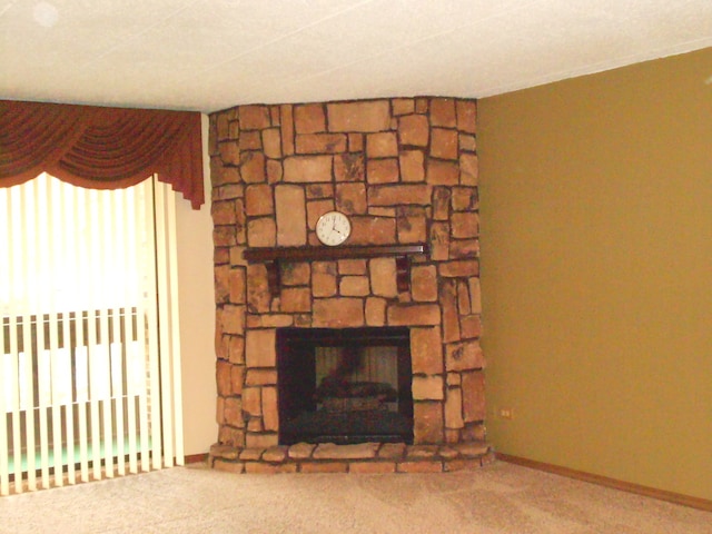 interior details featuring carpet and a fireplace