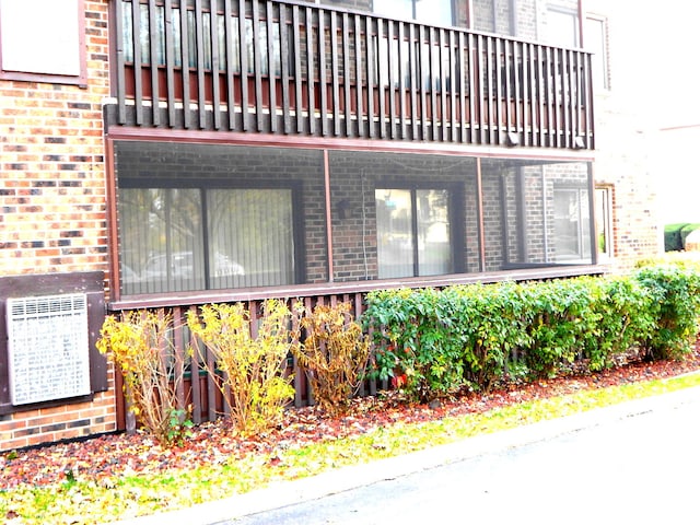 view of home's exterior with a balcony