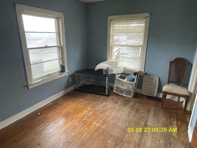 305 River Oaks Dr, Calumet City, IL 60409 - sitting room with baseboards, a healthy amount of sunlight, and wood finished floors