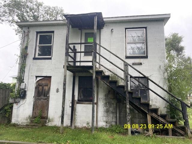 305 River Oaks Dr, Calumet City, IL 60409 - back of property featuring stairway and concrete block siding