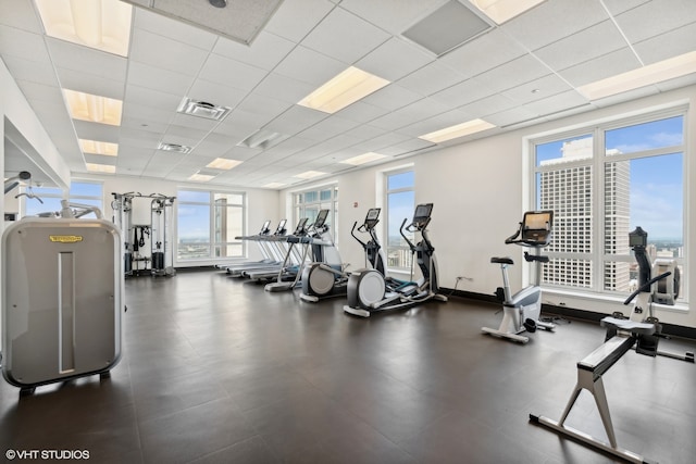 workout area with a paneled ceiling