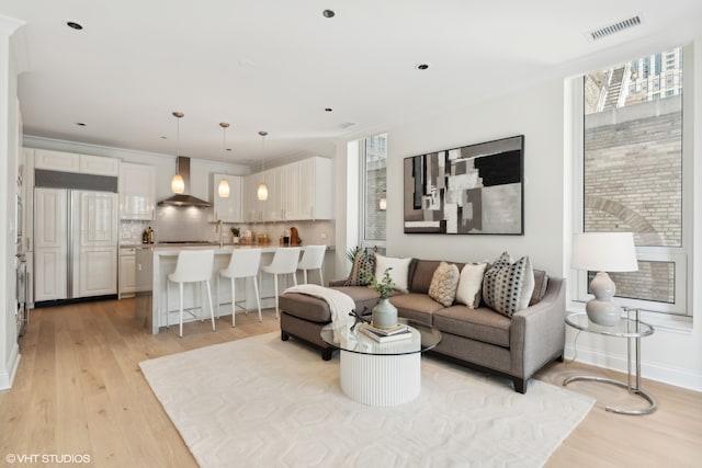 living room featuring light hardwood / wood-style flooring and plenty of natural light