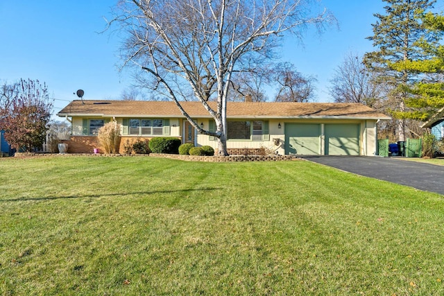 ranch-style house with a garage and a front yard