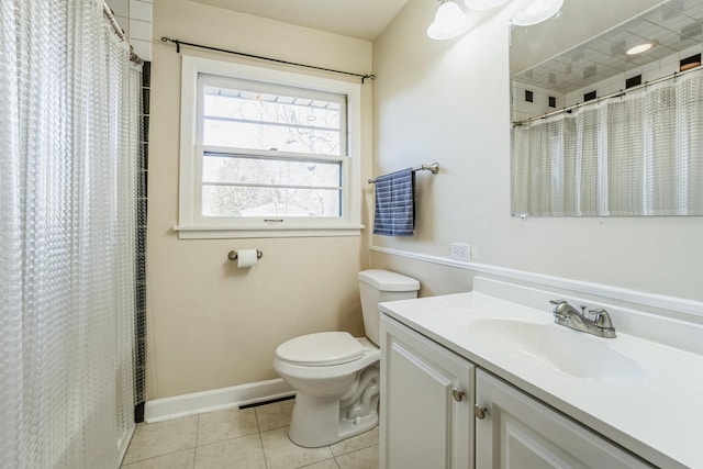 bathroom featuring tile patterned flooring, vanity, toilet, and curtained shower