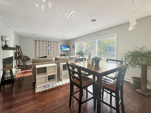 dining space featuring dark hardwood / wood-style flooring