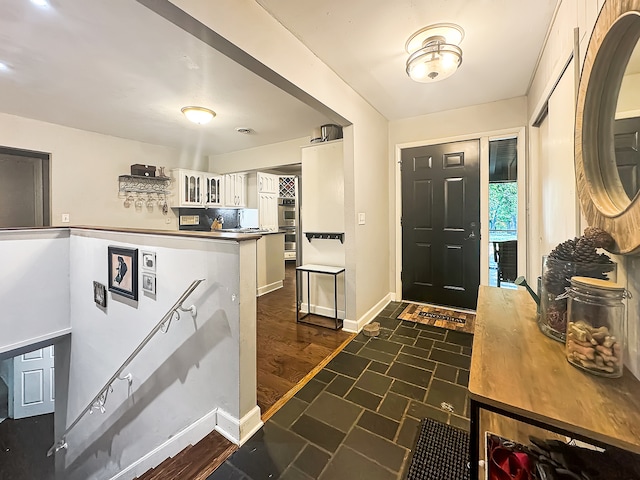 entryway featuring dark wood-type flooring