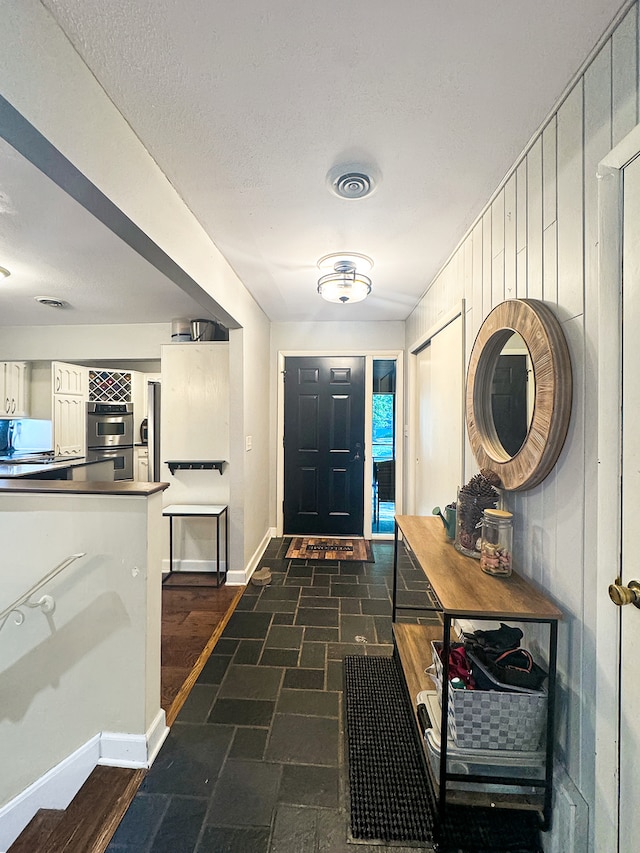 entrance foyer featuring a textured ceiling